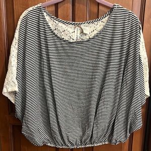 Cropped batwing striped black and white shirt with appliqué on back. Size Med.